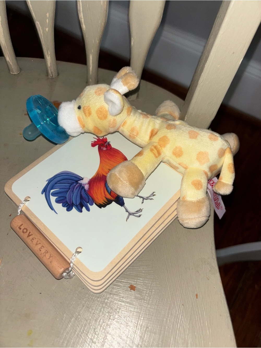 Wubbanub Plush Giraffe Pacifier. Lovevery wood book